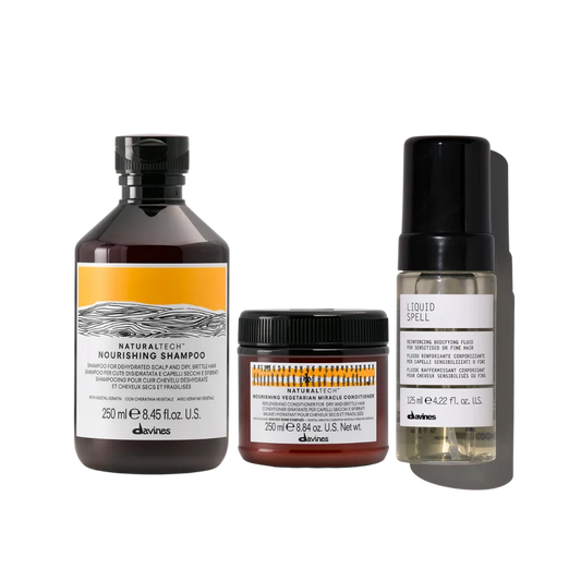 A set of three Davines hair care products including a shampoo, conditioner, and liquid spell treatment, with labels indicating their nourishing and repair properties.