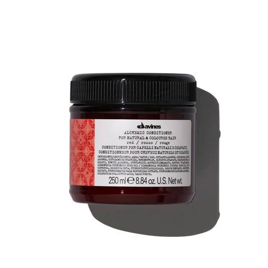 Davines ALCHEMIC Conditioner Red - Illuminating red hair conditioner - Color-enhancing conditioner for cool red tones. Alchemic Conditioner Red intensifies and illuminates these natural or colored cool red shades.