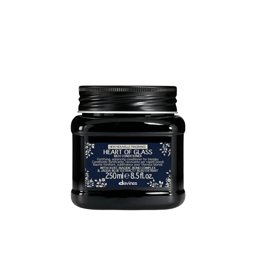A black plastic jar of Davinci's Heart of Glass Hair Conditioner with a dark navy blue label and white text, set against a plain white background.