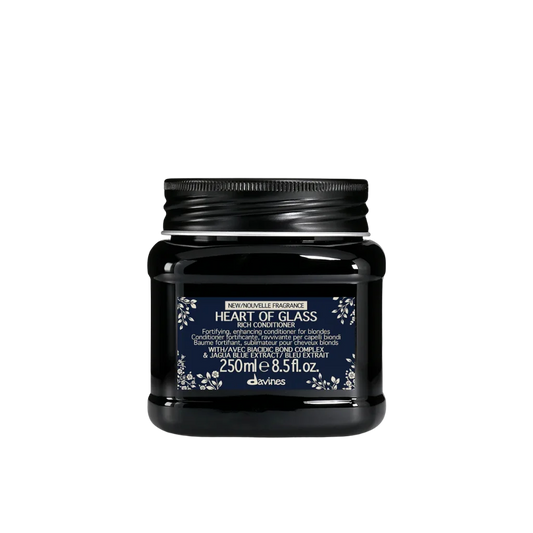 A black plastic jar of Davinci's Heart of Glass Hair Conditioner with a dark navy blue label and white text, set against a plain white background.