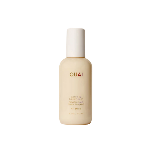 OUAI Leave In Conditioner bottle in a warm cream color with a white cap, centered on a solid white background.