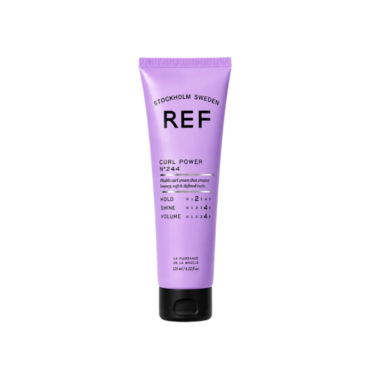 A lavender purple squeeze tube of REF Curl Power No. 544 hair cream with a black cap, centered on a plain white background.
