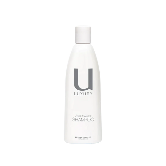 Pamper your hair with U LUXURY Shampoo, a sumptuous blend infused with coconut for gentle cleansing, along with argan oil and organic Hawaiian white honey to nourish and soften your hair. Infused with crushed pearl powder, it delivers essential nutrients for protection and a lustrous shine.
