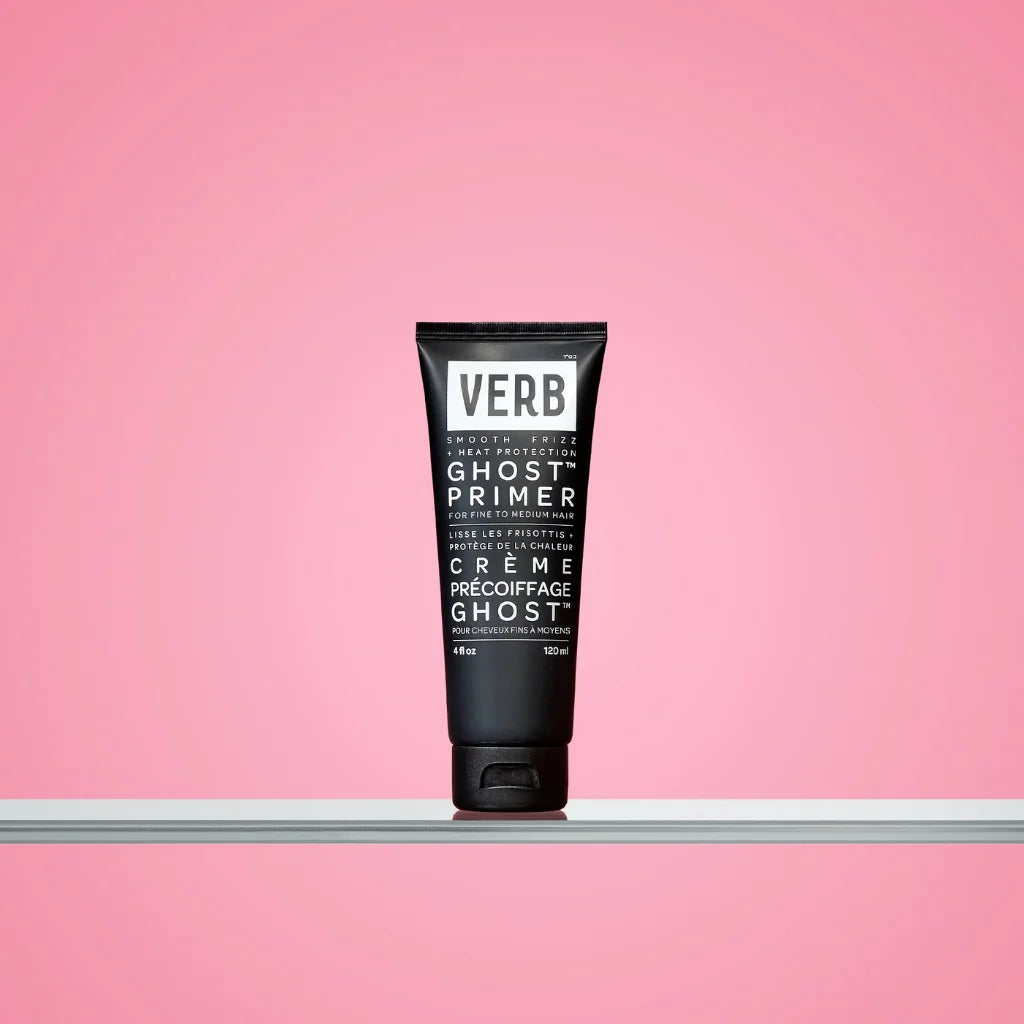 Black tube of Verb Ghost Primer on a pink background