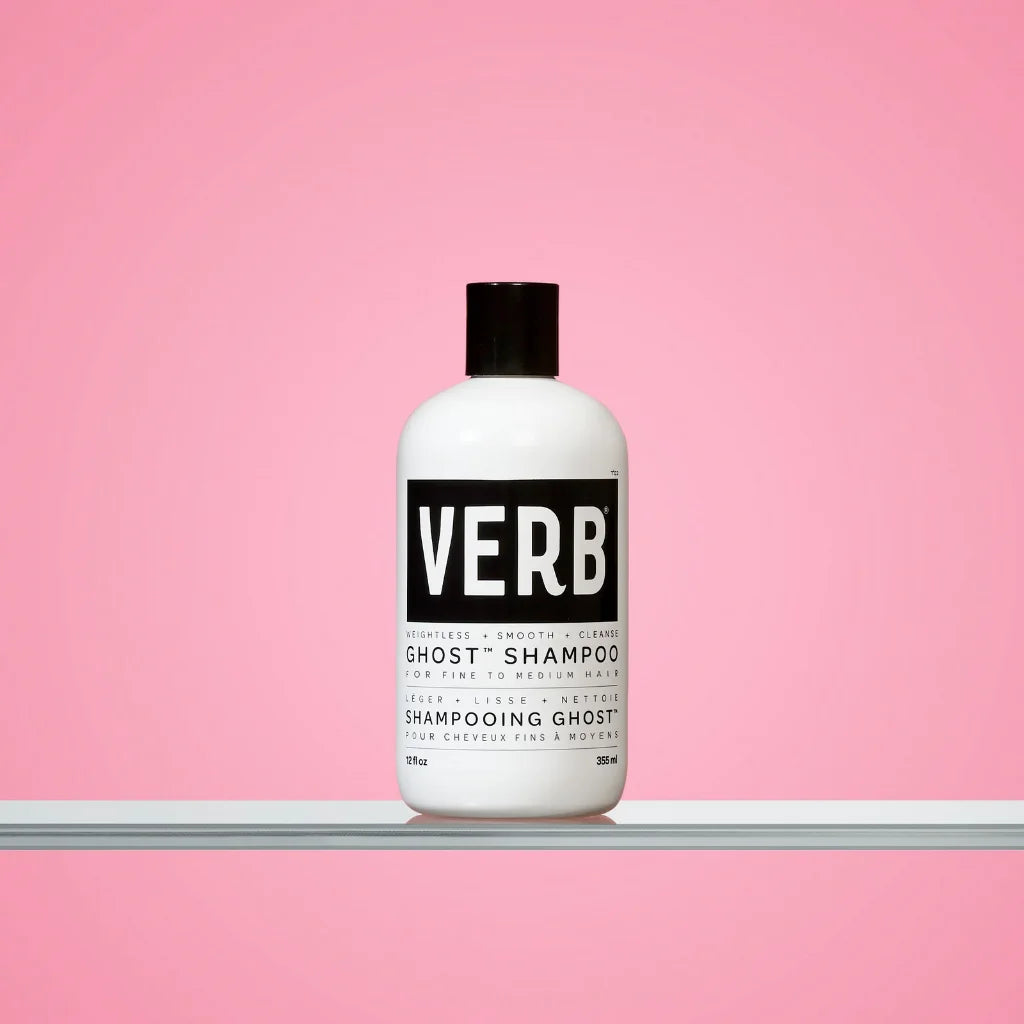 Verb shampoo bottle on a pink background