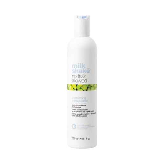 A 300 ml white bottle of Milk Shake No Frizz Allowed Perfecting Conditioner, featuring a white cap and a label with green and blue text and accents, set against a plain white background.